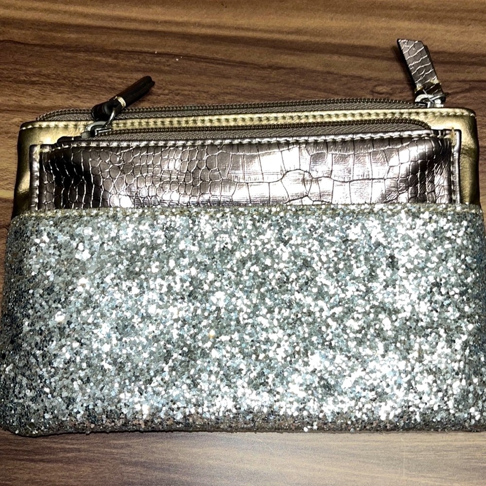 Ann Taylor Loft clutch bag is silver with glitter.